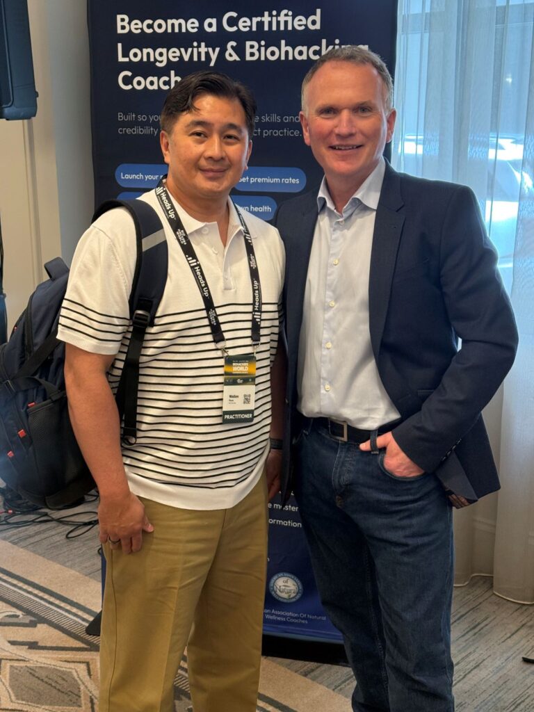 Wallen Reyes standing with Dr. Mark Atkinson after his Conscious Biohacking Masterclass at the Biohackers World Conference and Expo in New York.