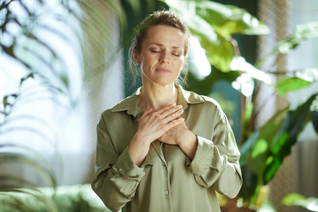 Woman practicing gentle somatic awareness to understand discomfort and danger in your body in a calm, safe environment.