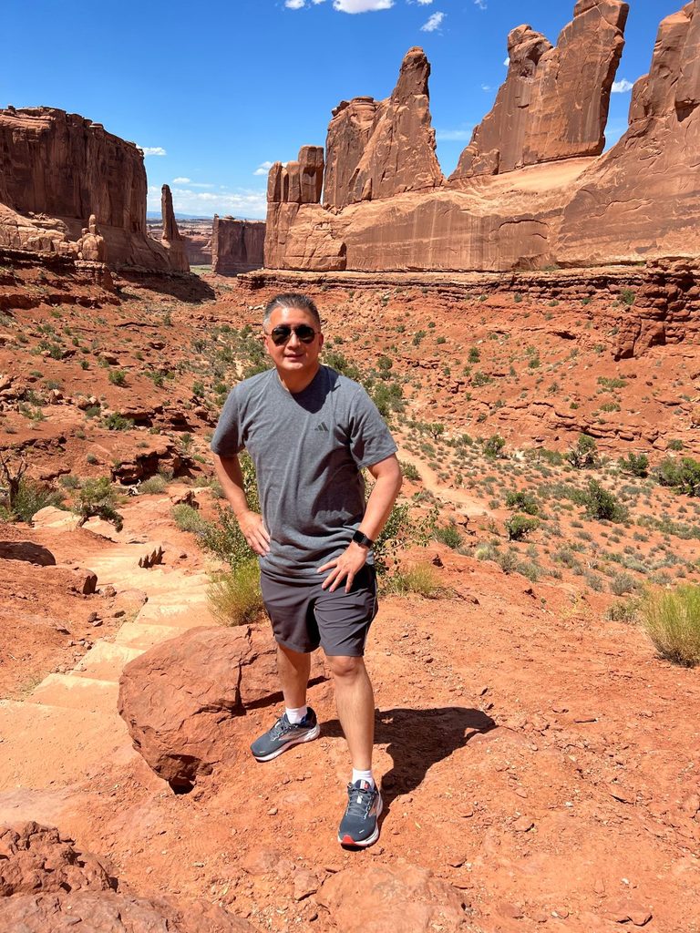 Cardiac arrest survivor taking a break during a family hike on July 17, 2023, three months after ICD surgery while rebuilding confidence in exercise.